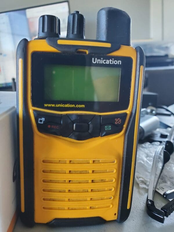 A Unication yellow and black walkie talkie